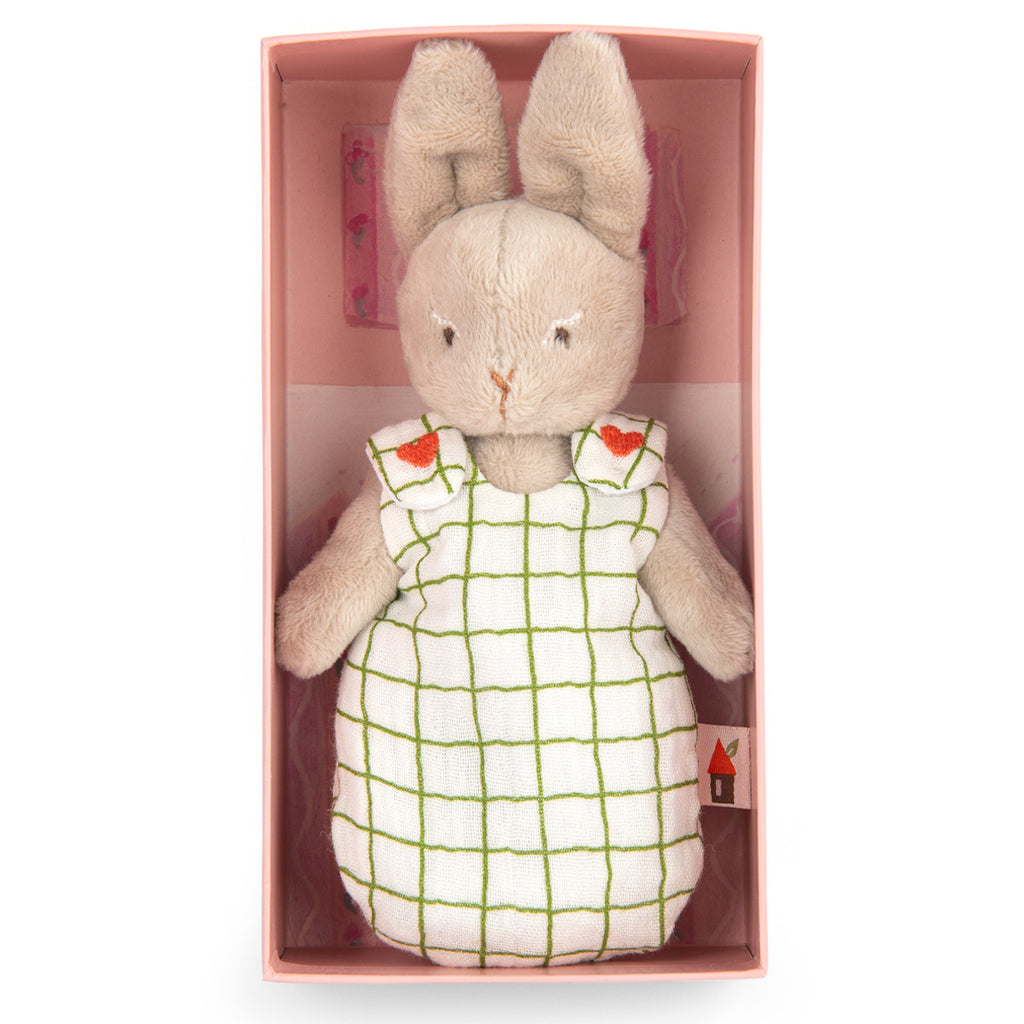 Soft plush bunny with beige fur, wearing a checkered green and white dress decorated with small heart accents. The tone is sweet and comforting.