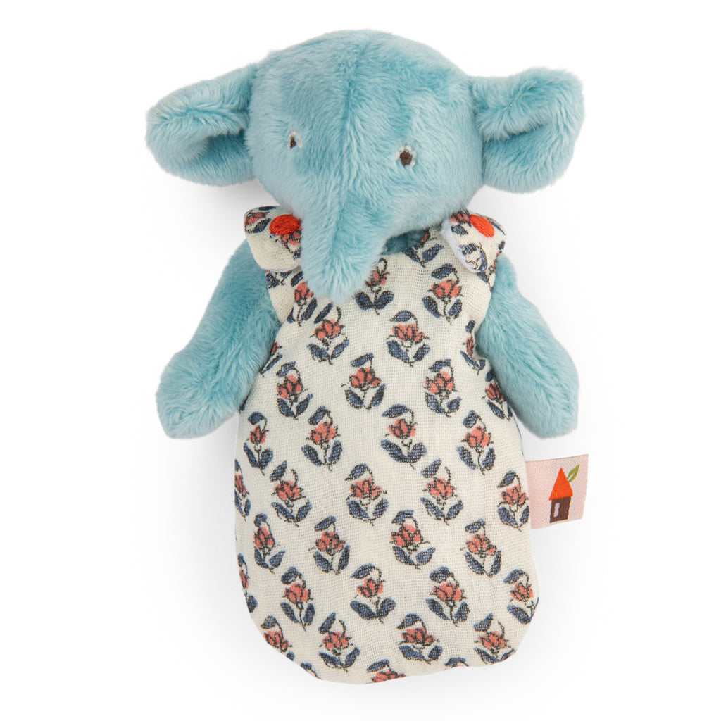 A plush toy elephant with light blue fur, wearing a patterned cloth dress with red and blue floral design, conveying a cute and gentle tone.