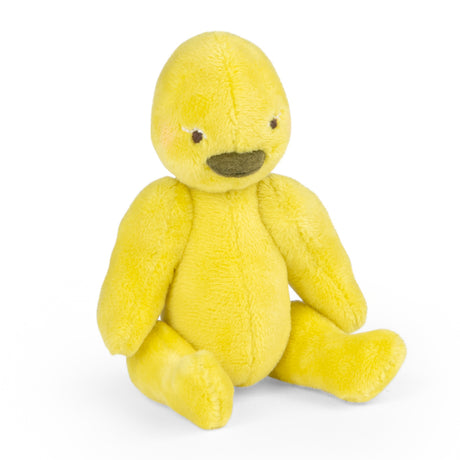Yellow plush duck toy Les Minouchkas Baby Rita sitting on white background.