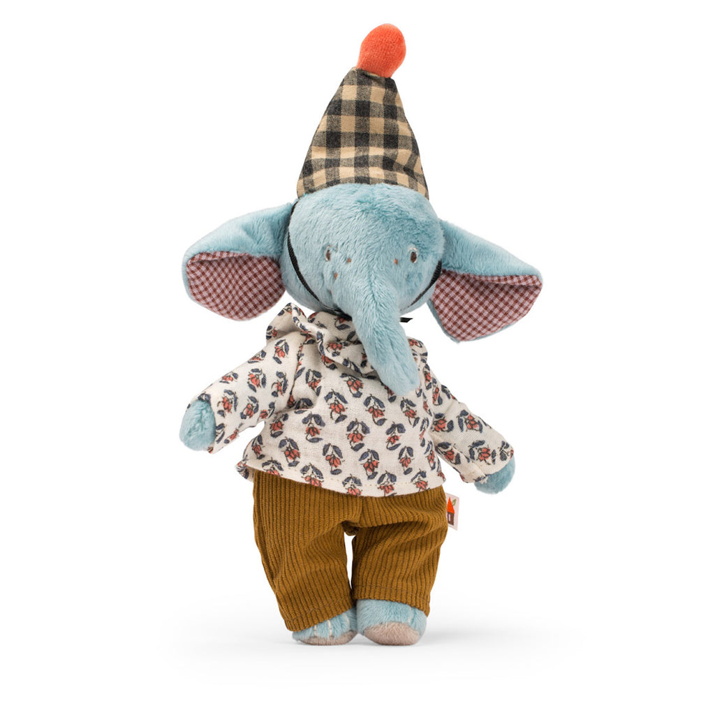 A soft toy elephant dressed in a patterned shirt and brown pants. It wears a checkered hat with an orange pompom, conveying a playful and whimsical vibe.