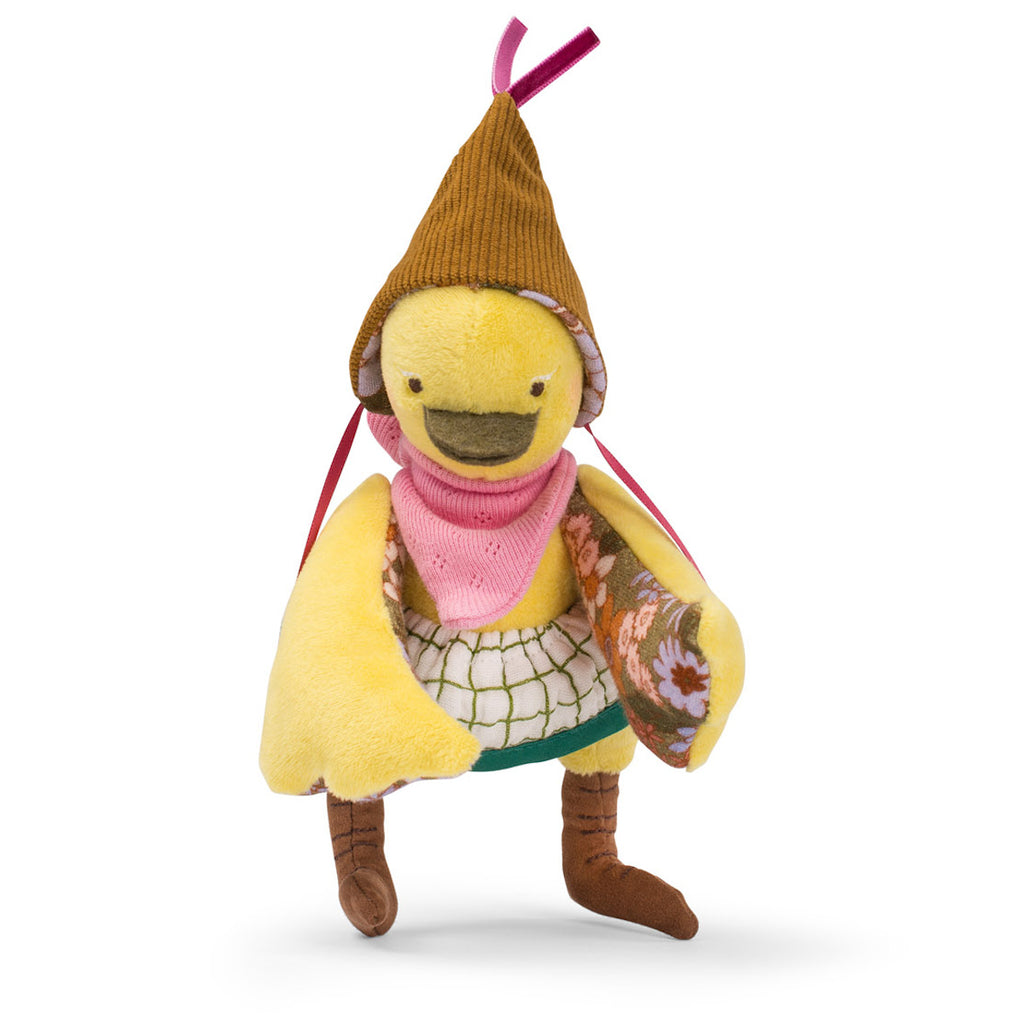 A plush yellow bird toy wearing a brown hat and pink scarf. It has patterned wings and brown legs, conveying a whimsical and cheerful vibe.