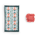 Floral doll mattress and red striped ruffled pillow set.
