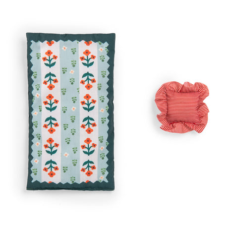 Floral doll mattress and red striped ruffled pillow set.