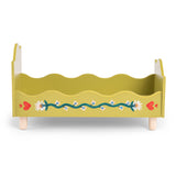 Olive green wooden doll bed with painted floral vine and red hearts design.