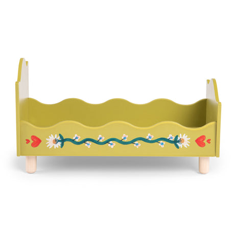 Olive green wooden doll bed with painted floral vine and red hearts design.