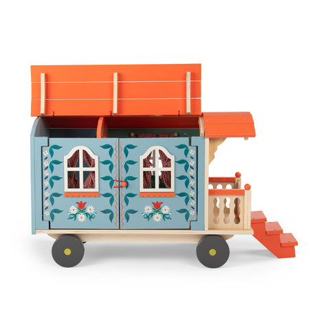 Les Minouchkas blue wooden toy caravan with orange roof, porch steps and floral details.