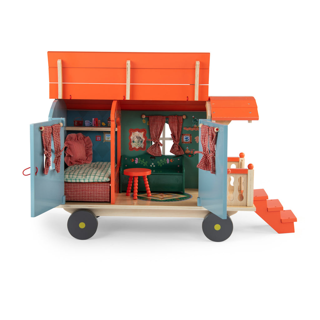 Toy wagon with a colorful design, featuring a blue body with floral patterns, an orange roof, and tiny stairs leading to a small porch on wheels.