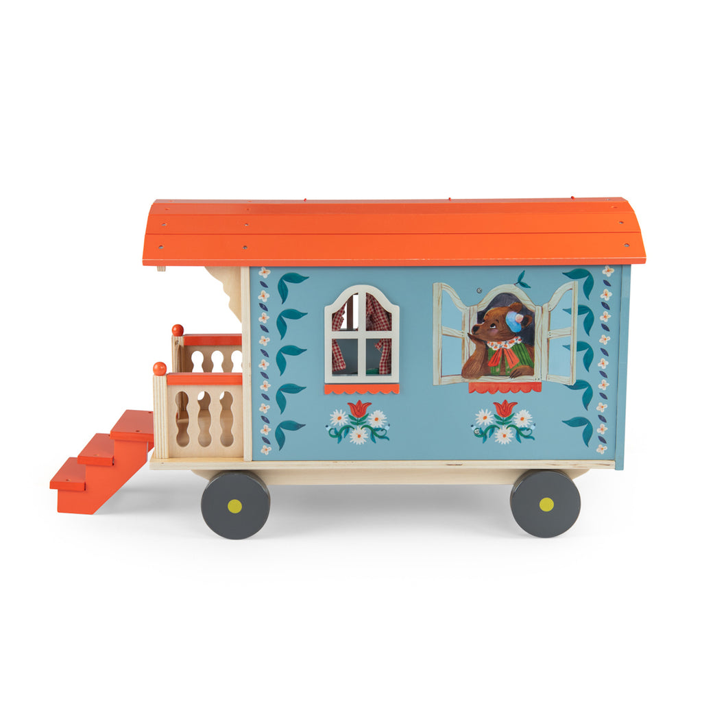 Toy wagon with a colorful design, featuring a blue body with floral patterns, an orange roof, and tiny stairs leading to a small porch on wheels.