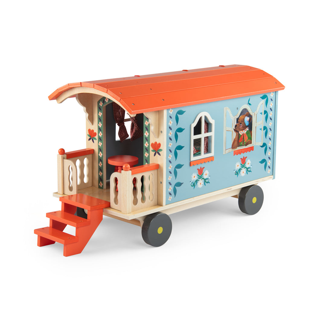 Toy wagon with a colorful design, featuring a blue body with floral patterns, an orange roof, and tiny stairs leading to a small porch on wheels.