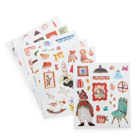Les Minouchkas sticker sheets featuring illustrated woodland animals, chairs, frames, and home decor items.