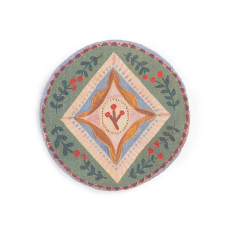 Round folk art coaster with green border, leaves, berries, and a center diamond design.