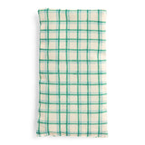 Green and cream plaid fabric eye pillow or small heat pack on a white background.