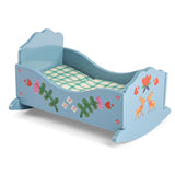 Blue wooden toy cradle with painted flowers and deer for Les Minouchkas dolls, featuring plaid bedding.