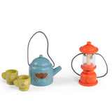 Les Minouchkas fireside accessories wooden toy set with a blue teapot, green cups, and orange lantern.