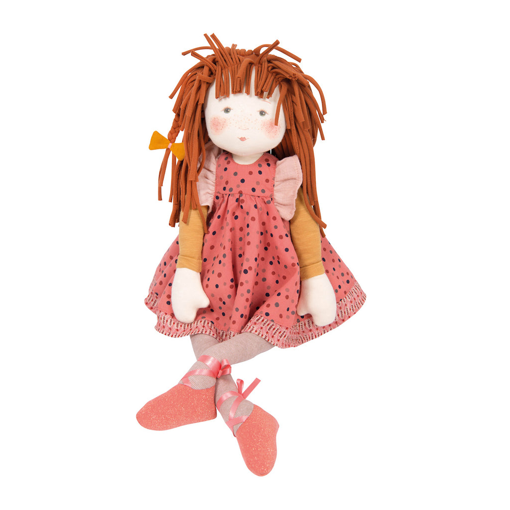 Soft fabric doll with brown yarn hair, wearing a pink polka-dotted dress, yellow sleeves, and pink ballet shoes. The doll has a gentle expression.