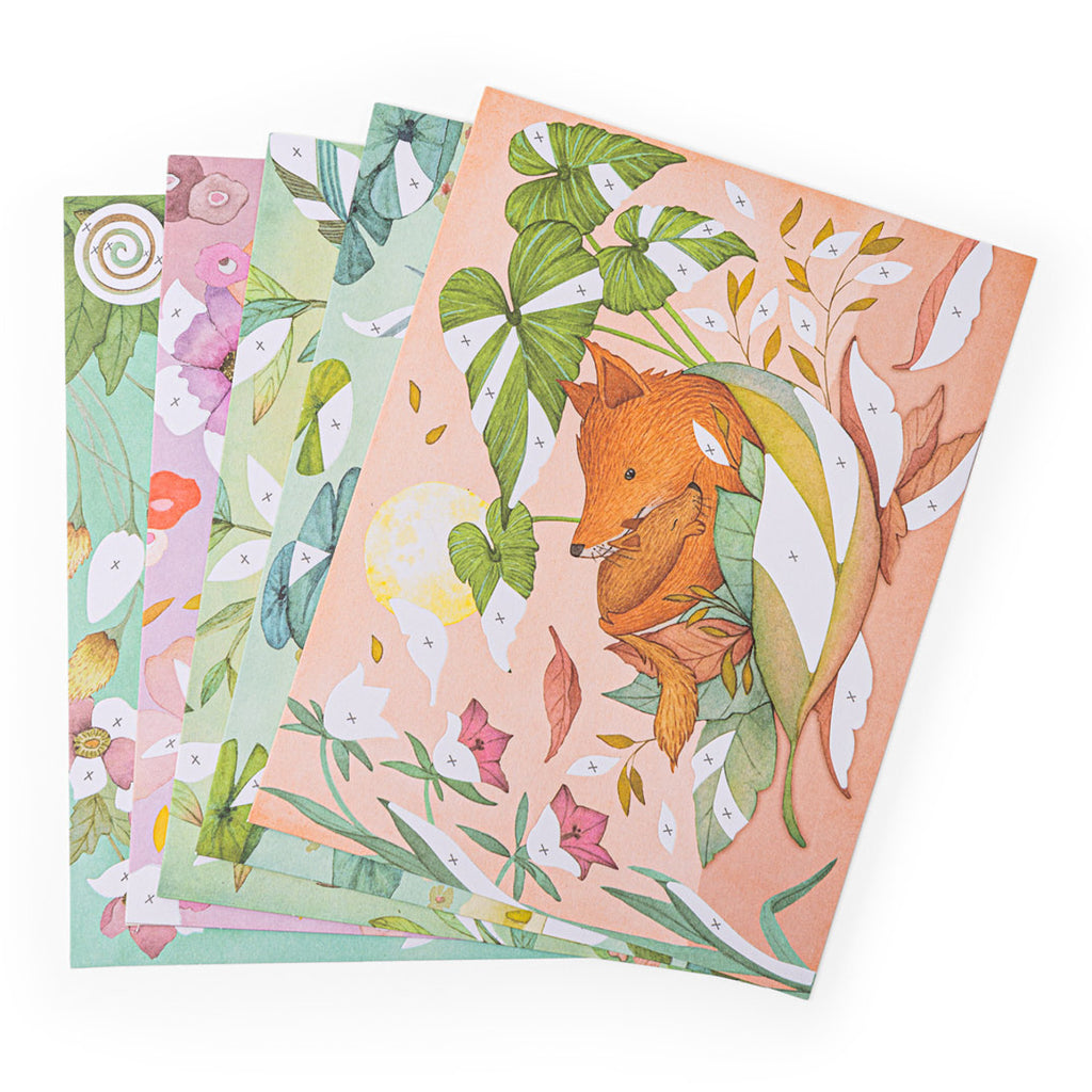 Artistic greeting cards with watercolor-style nature themes. A fox is surrounded by leaves on the top card. Soft, pastel colors convey a whimsical feel.