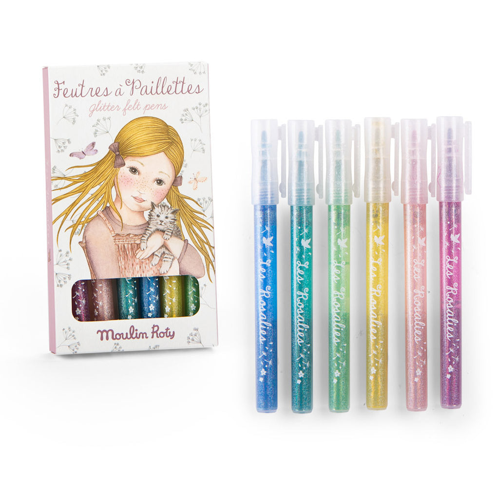 Set of six Moulin Roty glitter felt pens in vibrant colors. Packaging features a drawing of a girl with a kitten, adding a whimsical touch.