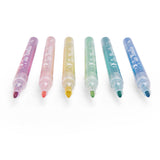 Set of six Les Rosalies colorful glitter felt pens lined up on a white background.