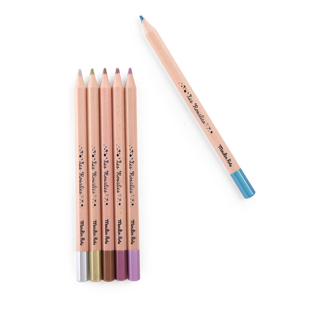 Six pastel-colored pencils, five forming a row with silver, gold, brown, and purple tips. One blue-tipped pencil lies separately above.