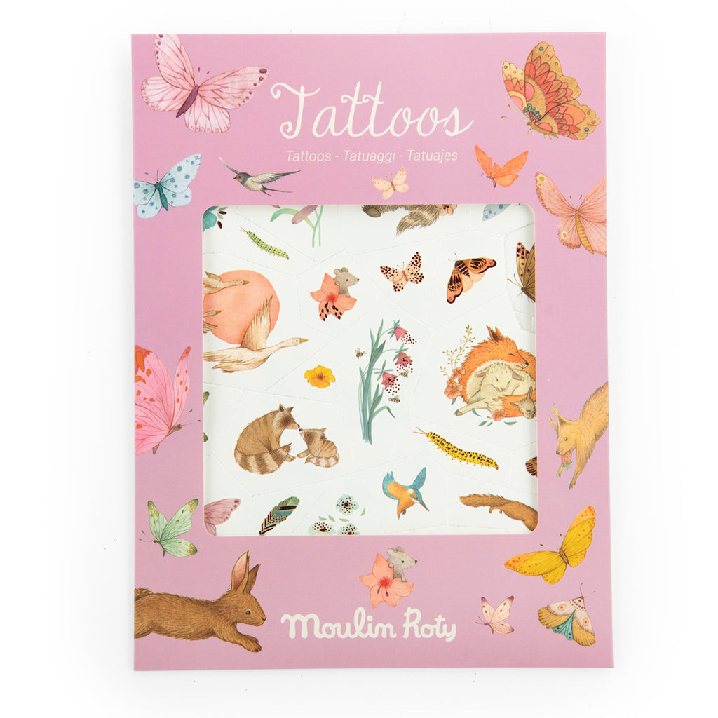 A colorful packaging of temporary tattoos by Moulin Roty, featuring illustrations of animals and insects like rabbits, butterflies, and birds against a pink background.