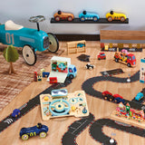 Wooden toy car set with race track, play dashboard, and ride-on car on a wooden floor.