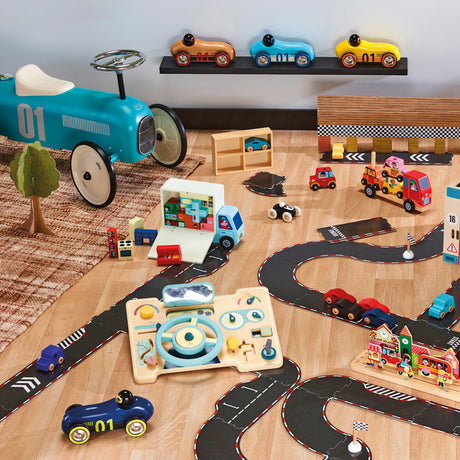 Wooden toy car set with race track, play dashboard, and ride-on car on a wooden floor.