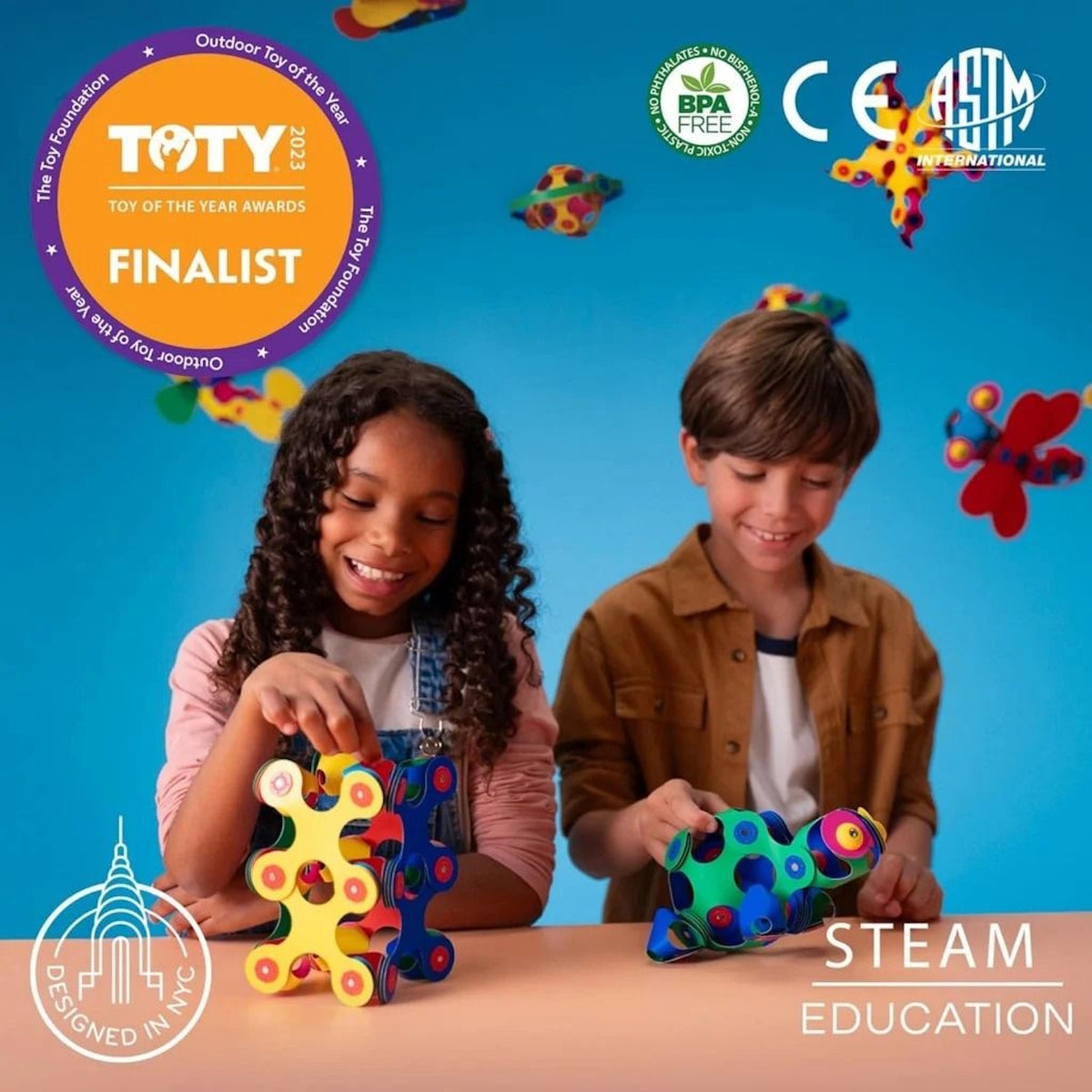 Two smiling children playing with colorful, magnetic building toys, featuring a "STEAM Education" label.