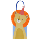 Meri Meri lion animal parade party bag with orange fringe mane, pink party hat, and blue handles on a white background.