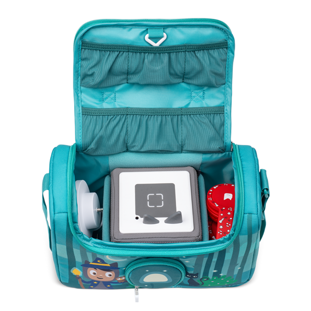 A vibrant blue bag featuring a whimsical wizard character, surrounded by forest animals and a moonlit backdrop in a white background.