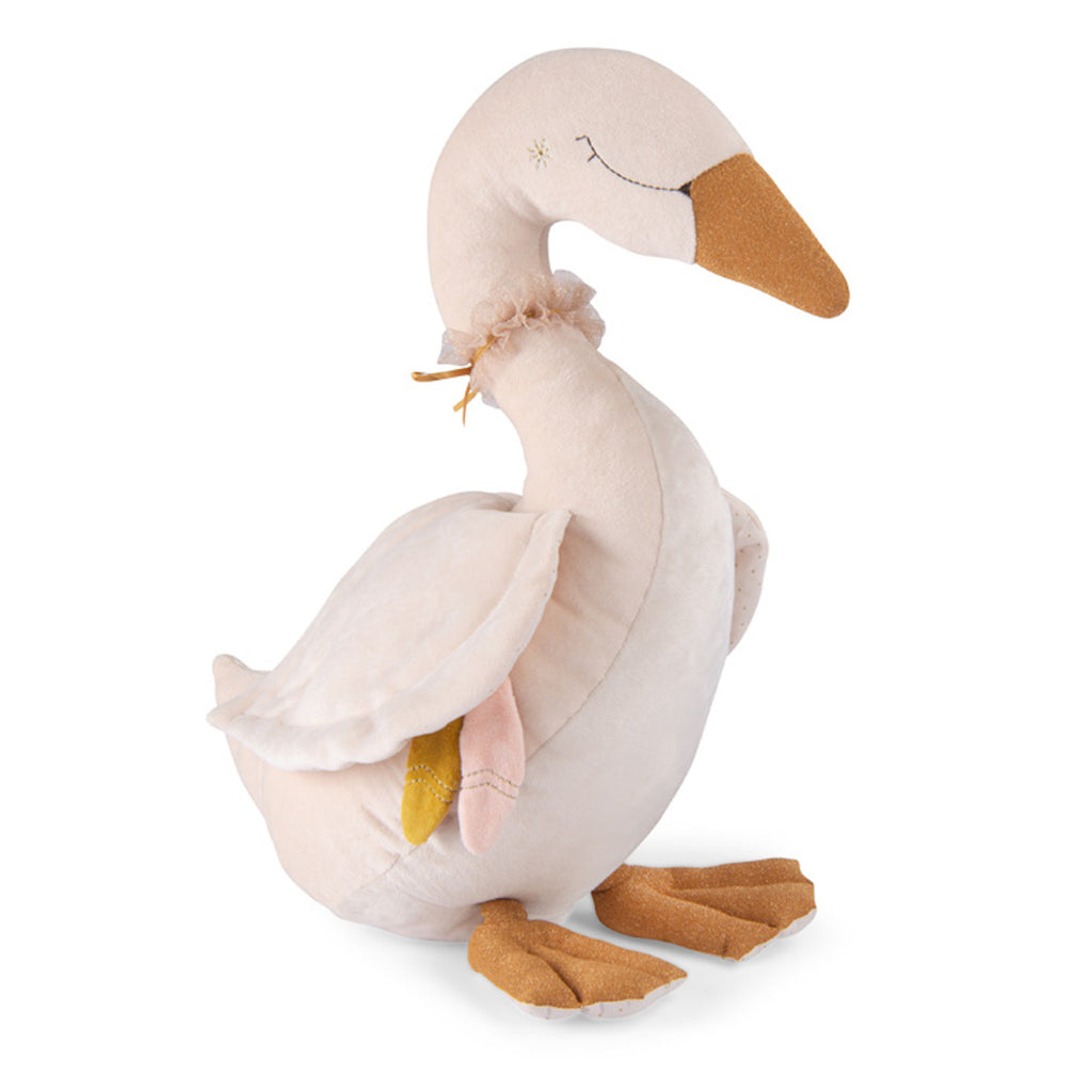 Plush swan toy with a cream body and golden beak, featuring soft textured wings and feet. The toy has a peaceful expression and a decorative neck bow.