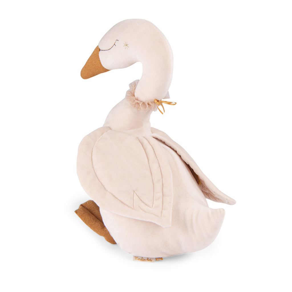 Plush swan toy with a cream body and golden beak, featuring soft textured wings and feet. The toy has a peaceful expression and a decorative neck bow.