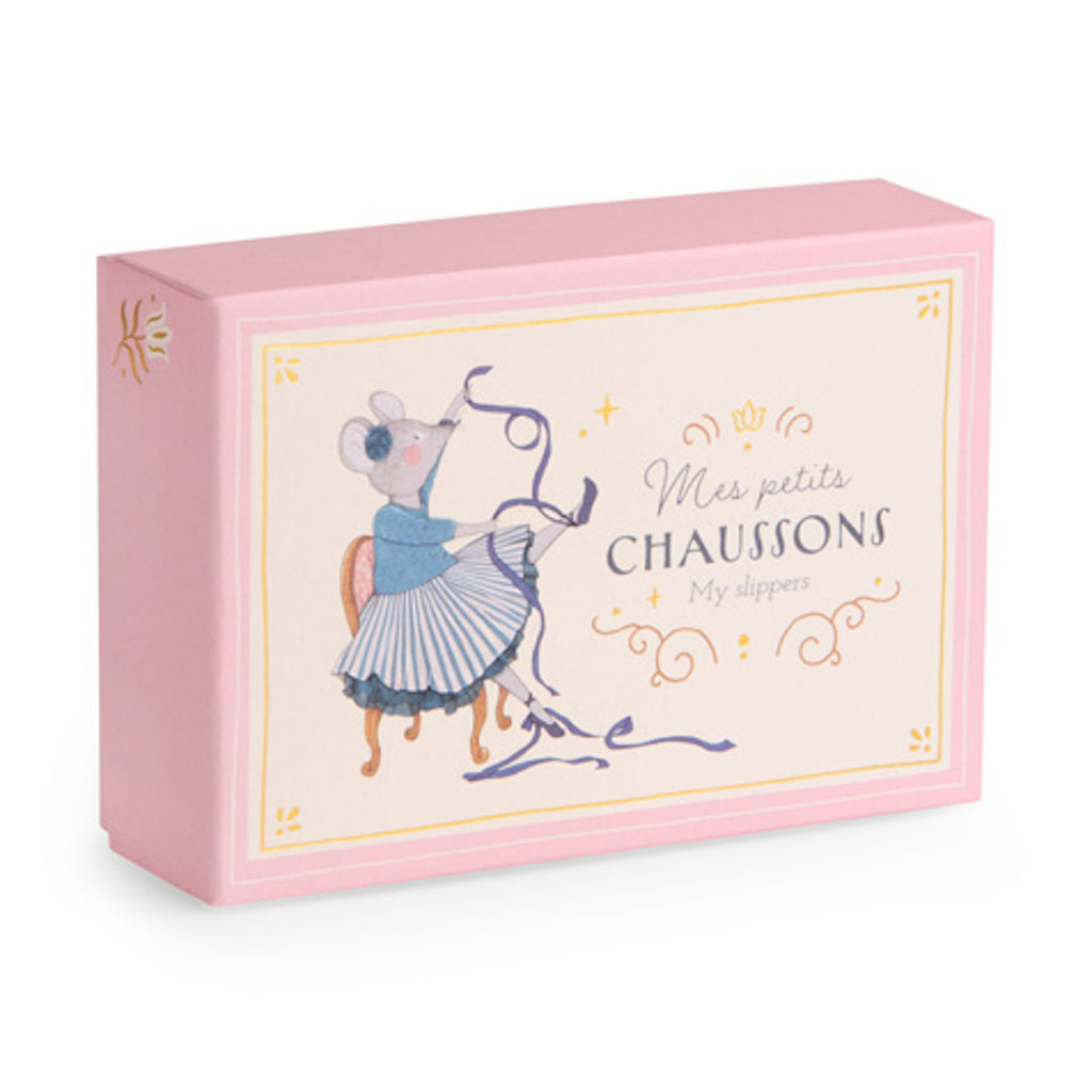 Pink box with an illustration of a mouse in a tutu tying ballet shoes. Text reads "Mes petits chaussons, My slippers," in elegant fonts. Whimsical and playful tone.