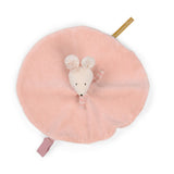 Soft pink plush toy in the shape of a mouse's head with ears and a striped tail on a round blanket, evoking a sense of warmth and comfort.