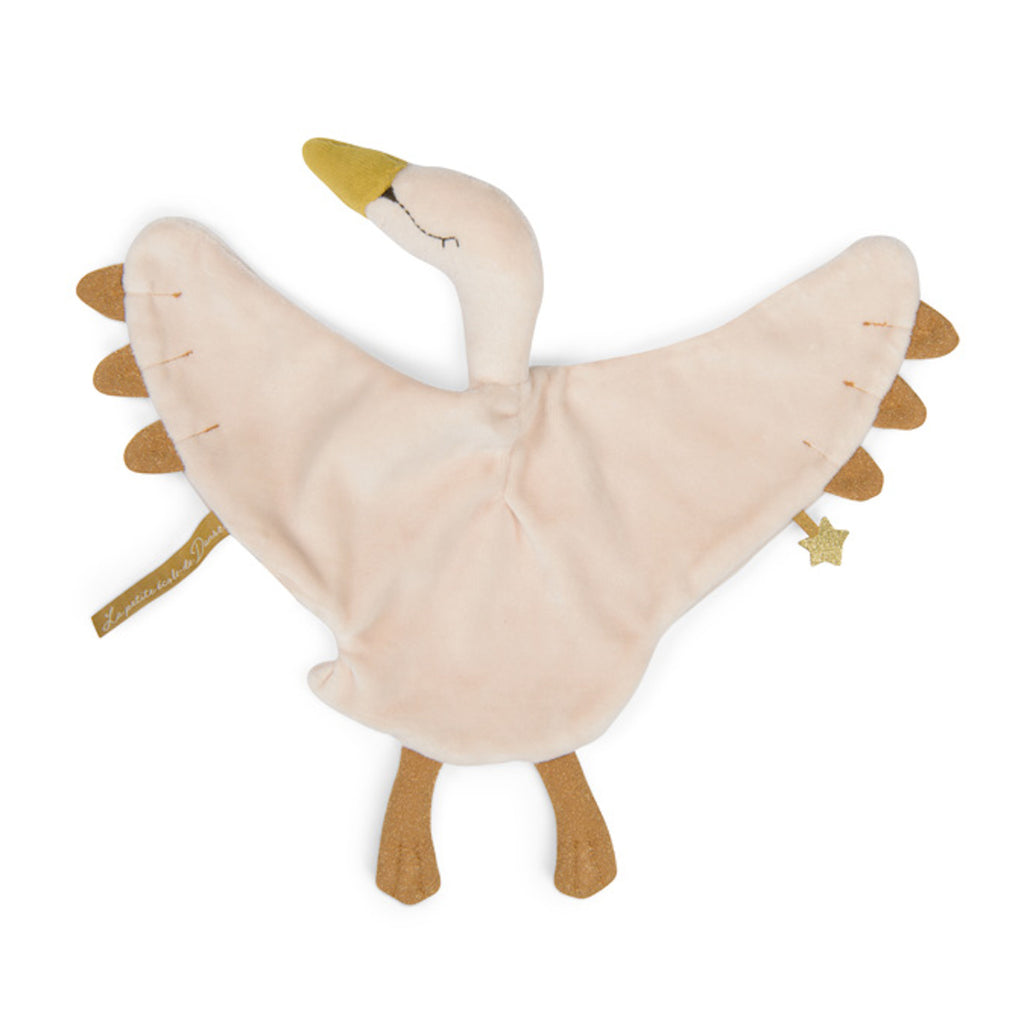 Soft, plush toy in the shape of a light pink and brown swan with wide wings. It features stitched eyes, a golden beak, and a tiny star accent.