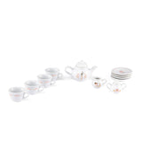 White porcelain kids play tea set with floral details, teacups, and a teapot.