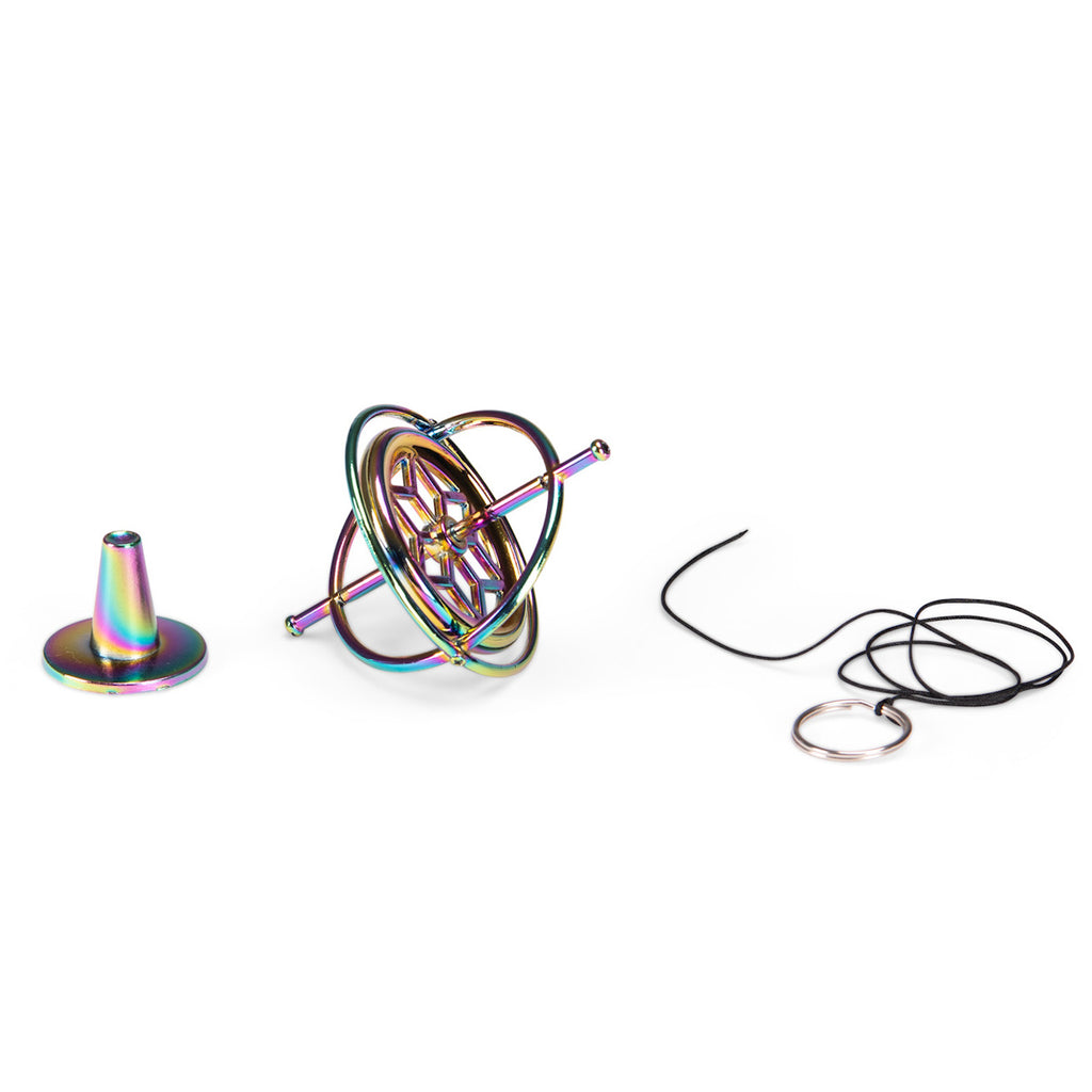 A metallic gyroscope with iridescent colors reflecting pink, blue, and gold hues. It features concentric rings and is set against a white background.