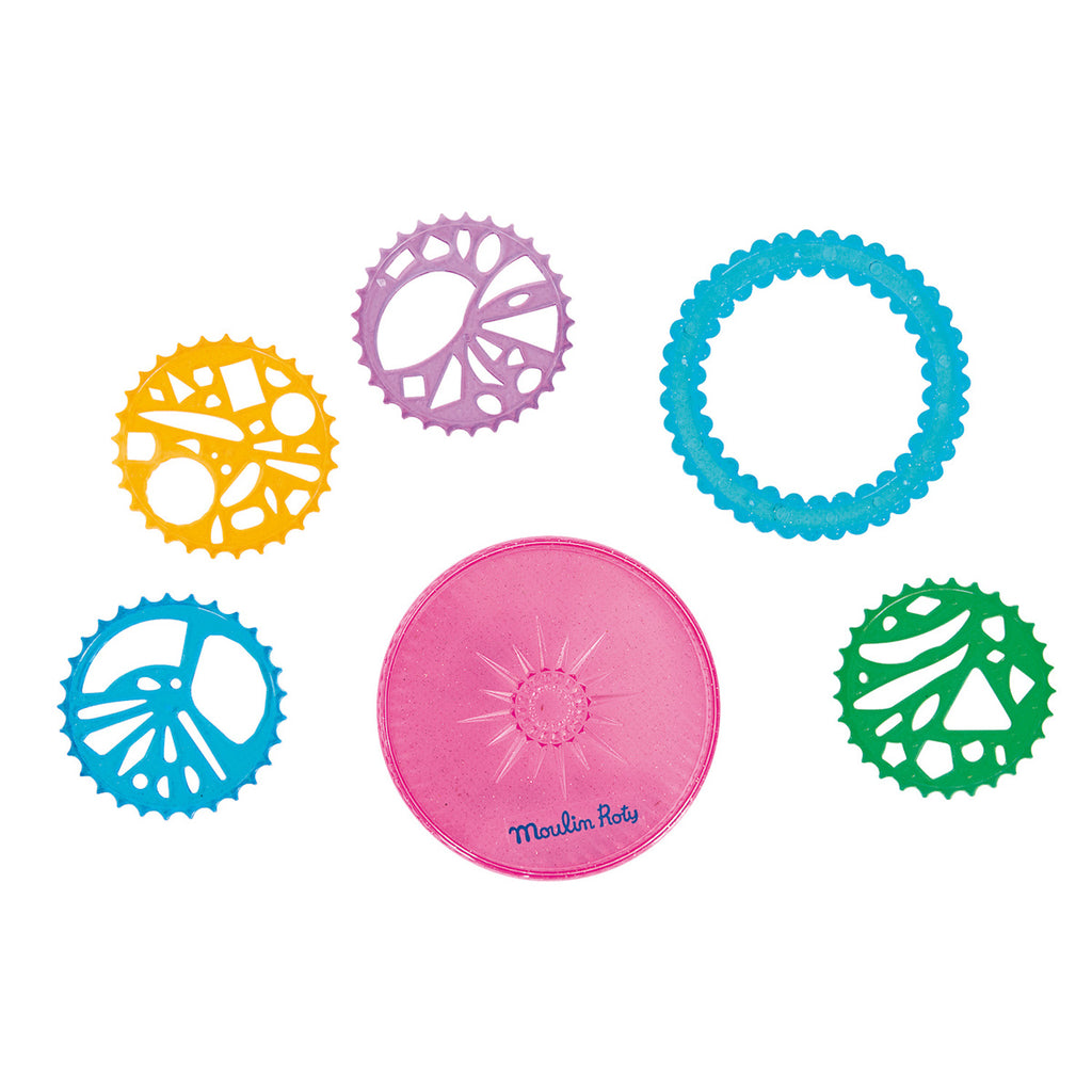 Colorful geometric tools for spirograph drawing, featuring intricate patterns in yellow, purple, blue, and green, surrounding a decorative pink and purple central piece.