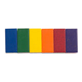 Moulin Roty multi colored wax crayon blocks in a row featuring blue, green, yellow, orange, red, and purple.