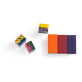Multi-colored rectangular wax crayon blocks for kids art and drawing projects on a white background.