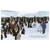 A child and a photographer stand on icy terrain, surrounded by a large colony of penguins. Icebergs are visible in the background. The mood is curious and adventurous.