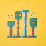 Colorful bird card game with illustrated trees, birds, and egg tokens on a bright yellow background.