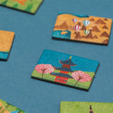 Colorful Londji Wonderful World game tiles featuring a Japanese pagoda and cherry blossoms on a blue background.