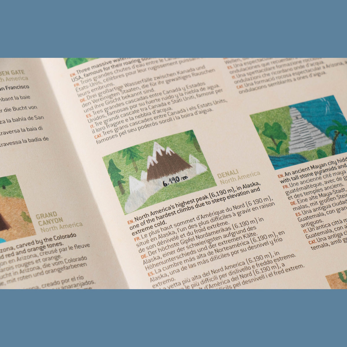 Close-up of a Londji educational booklet featuring Denali, with multilingual descriptions and colorful illustrations.