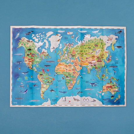 Colorful illustrated world map for children featuring regional animals, landmarks, and sea life on a blue background.