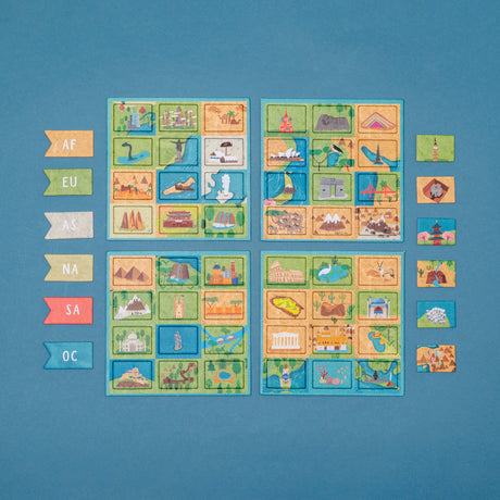 World map matching game with colorful landmark tiles, continent flags, and illustrated boards on a blue background.