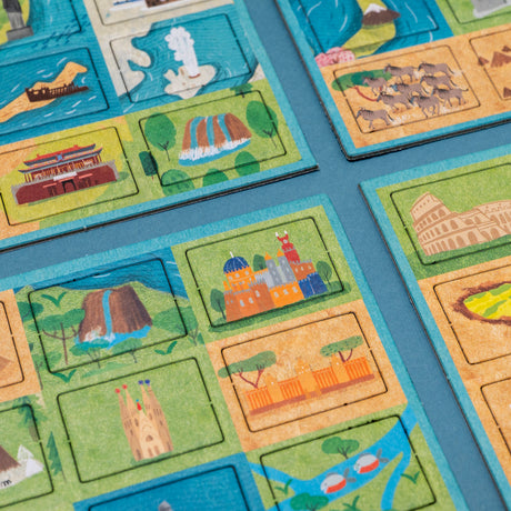 Educational world map puzzle tiles featuring colorful illustrations of global landmarks like the Colosseum and Sagrada Familia.