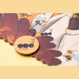 Londji Bears Forest puzzle pieces showing an ant disc and illustrations of bees and forest creatures.