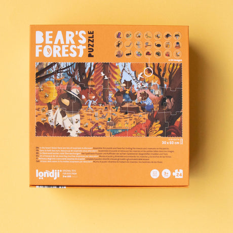 Back of Londji Bear's Forest puzzle box showing a completed woodland scene and observation game tokens.