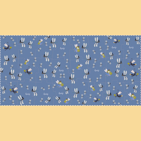 Londji puzzle featuring a whimsical dragonfly and fairy pattern on a blue background with a scalloped edge.