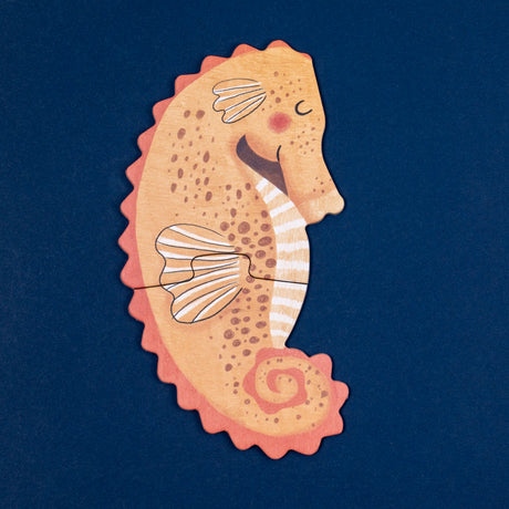 Londji "Blue" toddler puzzle featuring a 2-piece illustrated orange seahorse on a dark blue background.